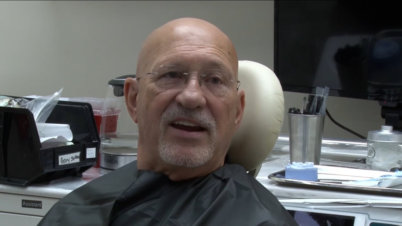 Gary S., a LOCATOR FIXED patient, talking in the dental chair